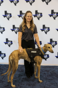 Women of Law Enforcement Therapy Dog in front of backdrop